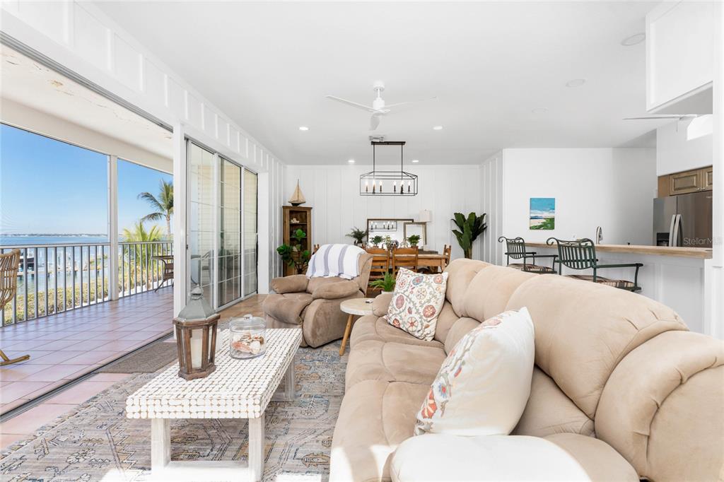 1400 Beach Road, Unit 1 Englewood, FL 34223 - Photo 11 of 68 a living room with furniture white walls and wooden floor