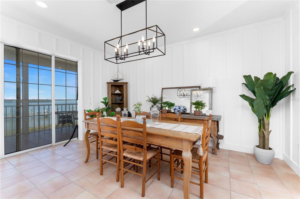 1400 Beach Road, Unit 1 Englewood, FL 34223 - Photo 18 of 68 a view of a dining room with furniture window and wooden floor