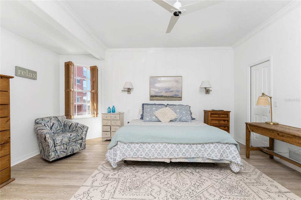 1400 Beach Road, Unit 1 Englewood, FL 34223 - Photo 28 of 68 a bedroom with a bed and a couch