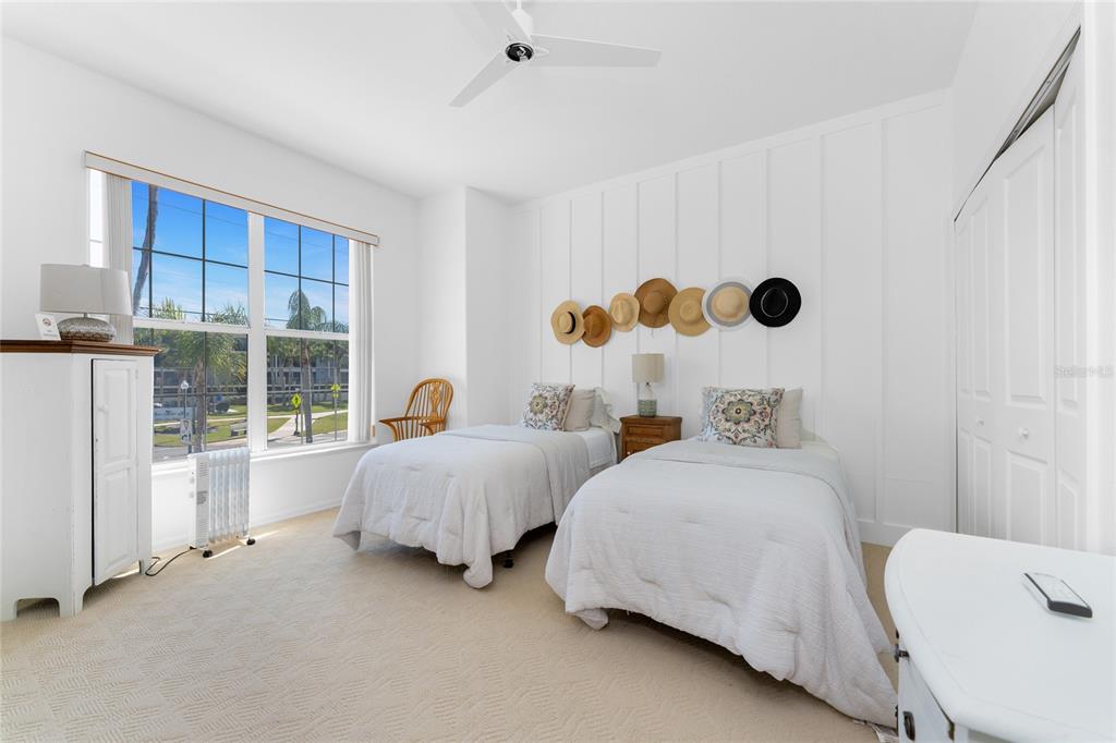 1400 Beach Road, Unit 1 Englewood, FL 34223 - Photo 34 of 68 a bedroom with two beds and a large window