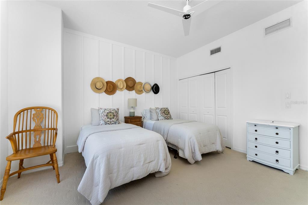 1400 Beach Road, Unit 1 Englewood, FL 34223 - Photo 35 of 68 a bedroom with two beds and painted walls