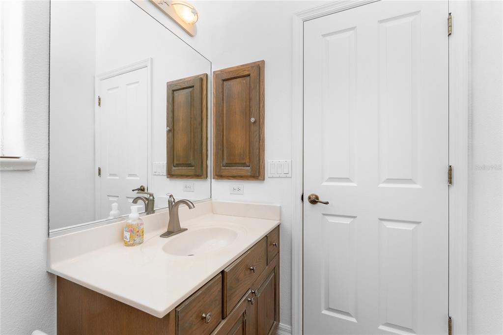 1400 Beach Road, Unit 1 Englewood, FL 34223 - Photo 39 of 68 a bathroom with a sink and a mirror