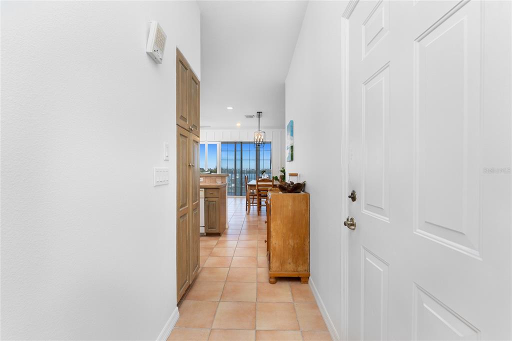 1400 Beach Road, Unit 1 Englewood, FL 34223 - Photo 4 of 68 a view of a kitchen with refrigerator and a stove