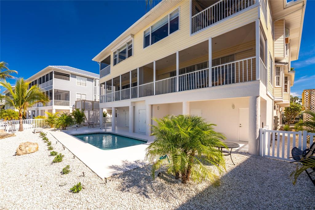 1400 Beach Road, Unit 1 Englewood, FL 34223 - Photo 42 of 68 a front view of a house with a yard
