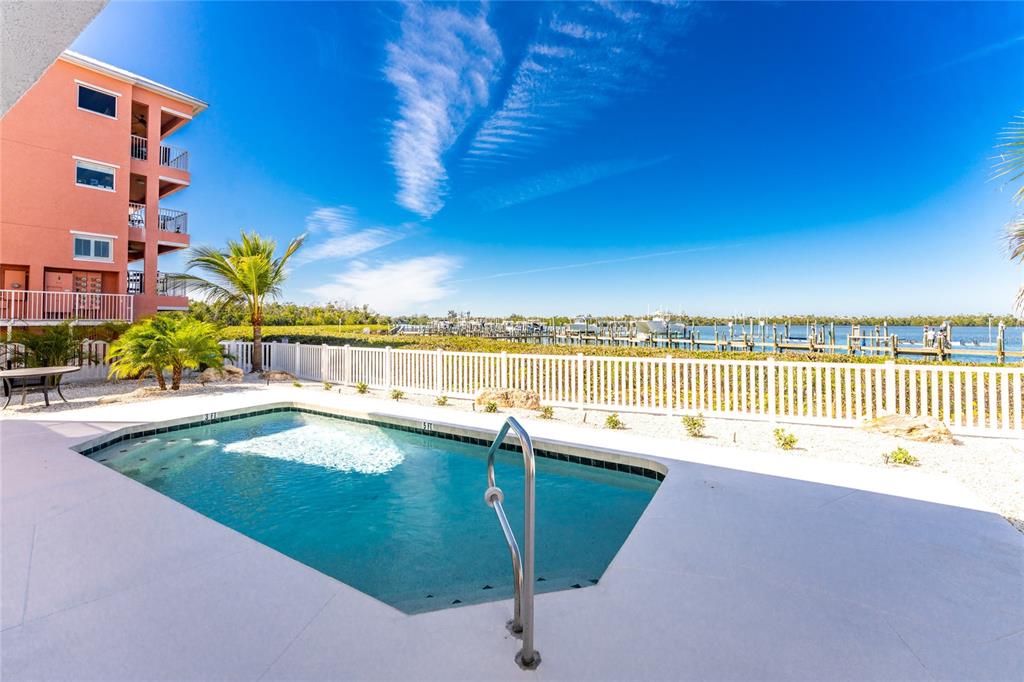 1400 Beach Road, Unit 1 Englewood, FL 34223 - Photo 45 of 68 a view of a swimming pool and an outdoor space