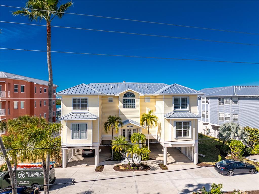 1400 Beach Road, Unit 1 Englewood, FL 34223 - Photo 49 of 68 a front view of a house with a yard