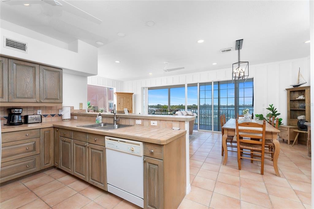 1400 Beach Road, Unit 1 Englewood, FL 34223 - Photo 5 of 68 a kitchen with a sink and cabinets