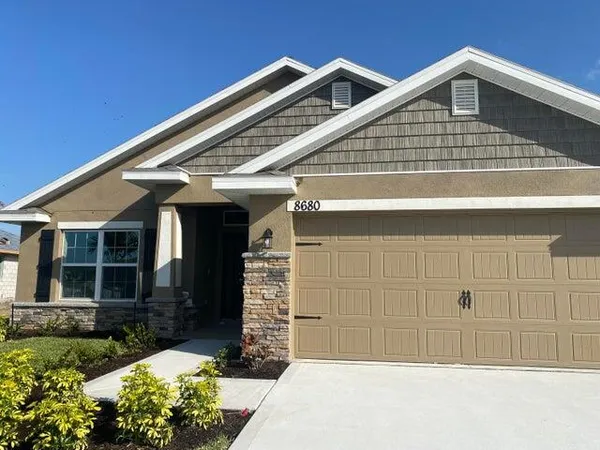 a view of a house with a garage