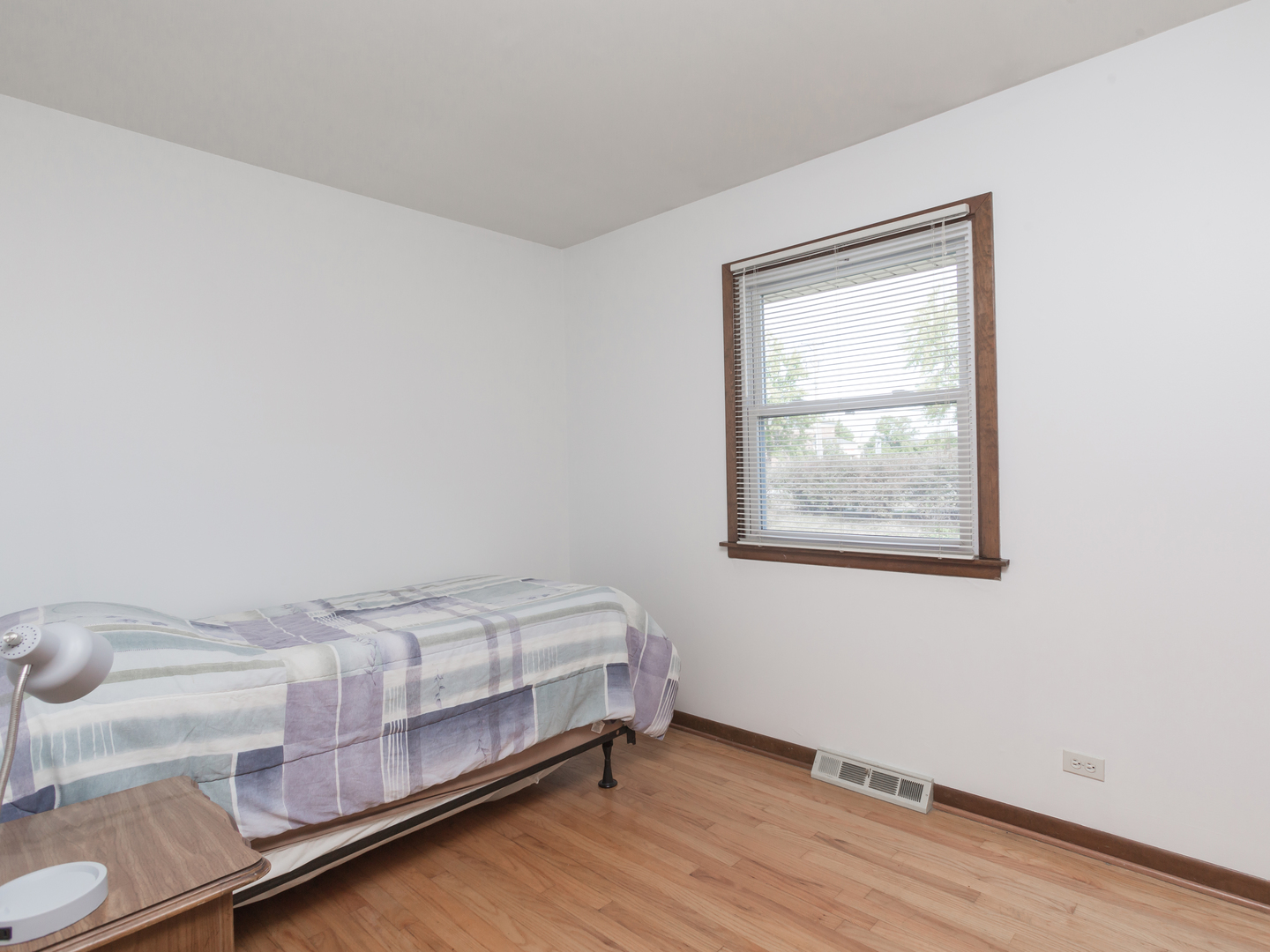 111 East Devon Avenue Bartlett, IL 60103 - Photo 12 of 20 a bedroom with a bed and a window