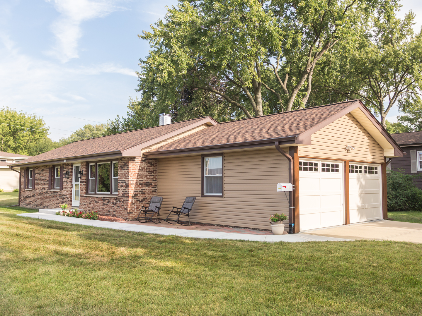 111 East Devon Avenue Bartlett, IL 60103 - Photo 3 of 20 a front view of house with yard and seating area