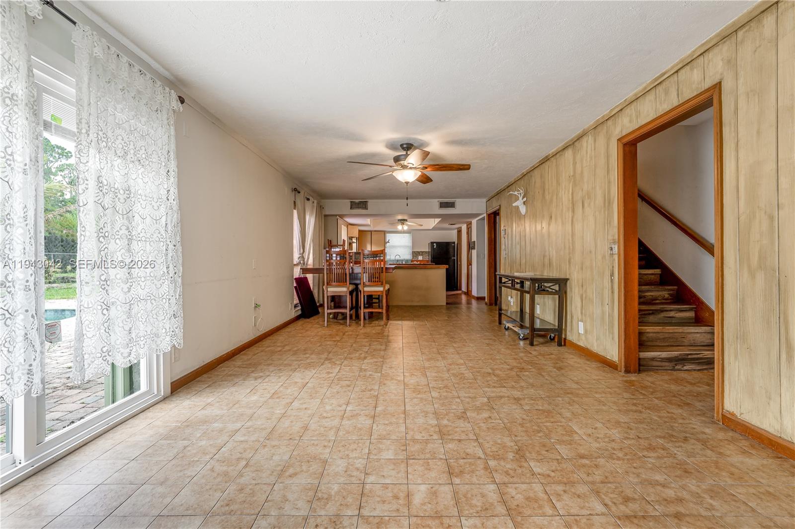 576 Marshall Road West Palm Beach, FL 33413 - Photo 26 of 44 a view of a livingroom with furniture and a ceiling fan