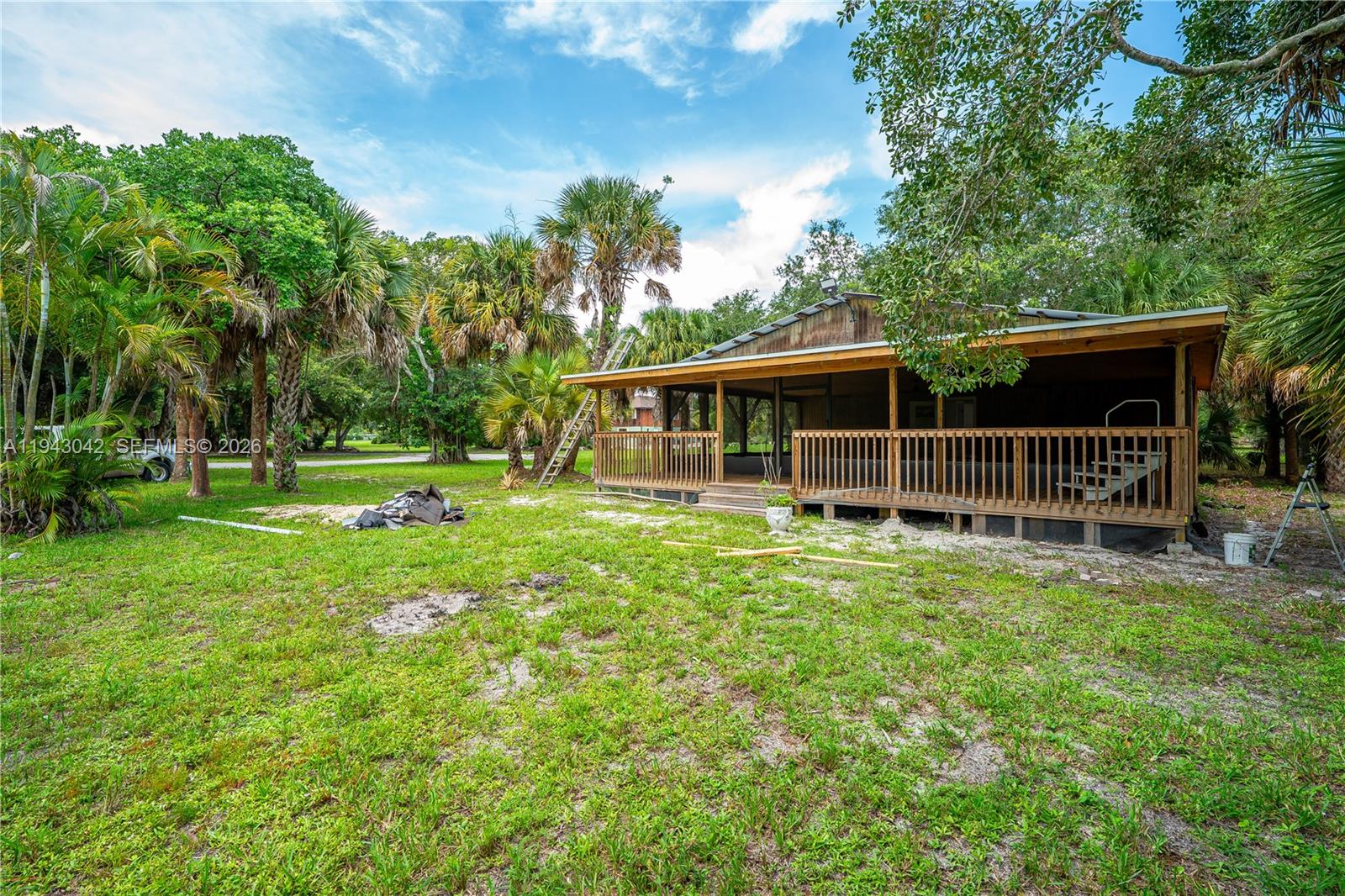 576 Marshall Road West Palm Beach, FL 33413 - Photo 40 of 44 a view of a house with backyard and a garden