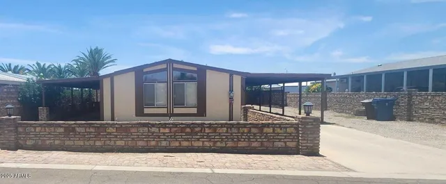 a front view of house with yard outdoor seating and barbeque oven