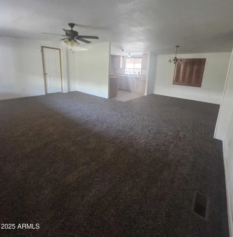 a view of empty room with windows