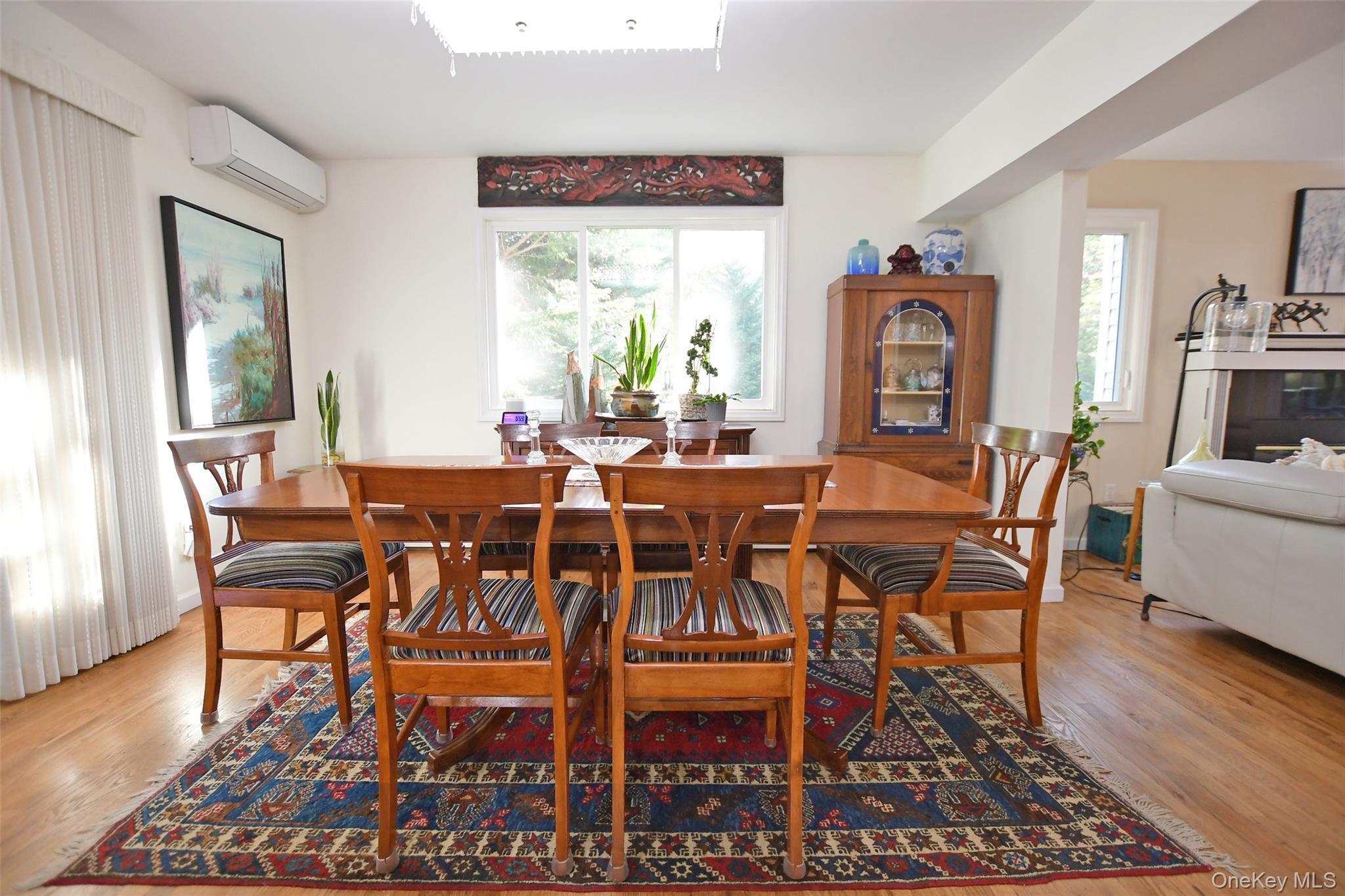 64 Glen Road Baiting Hollow, NY 11933 - Photo 13 of 46 Dining area featuring light wood-style flooring and an AC wall unit