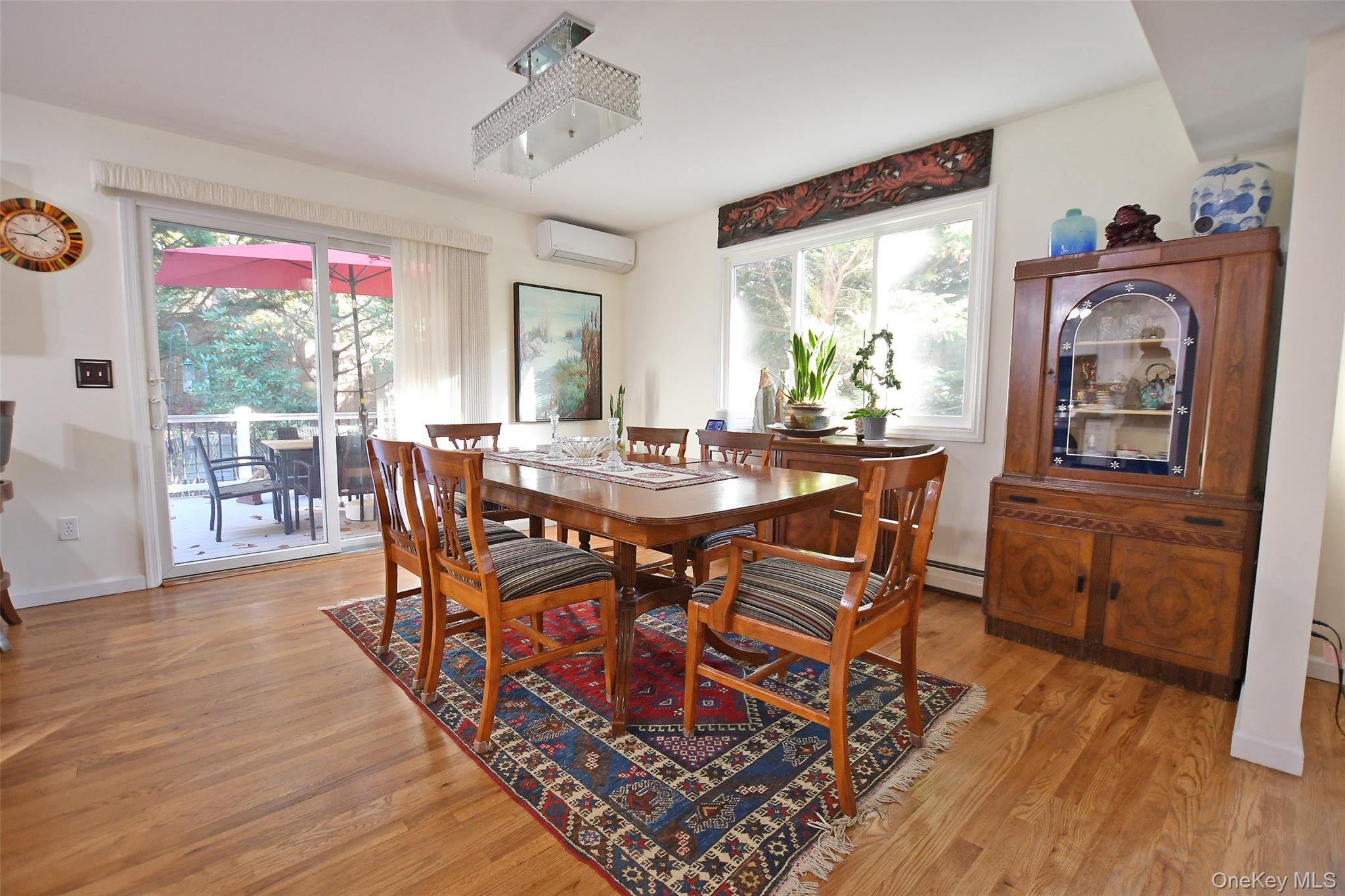 64 Glen Road Baiting Hollow, NY 11933 - Photo 14 of 46 Dining room featuring light wood-style flooring and an AC wall unit
