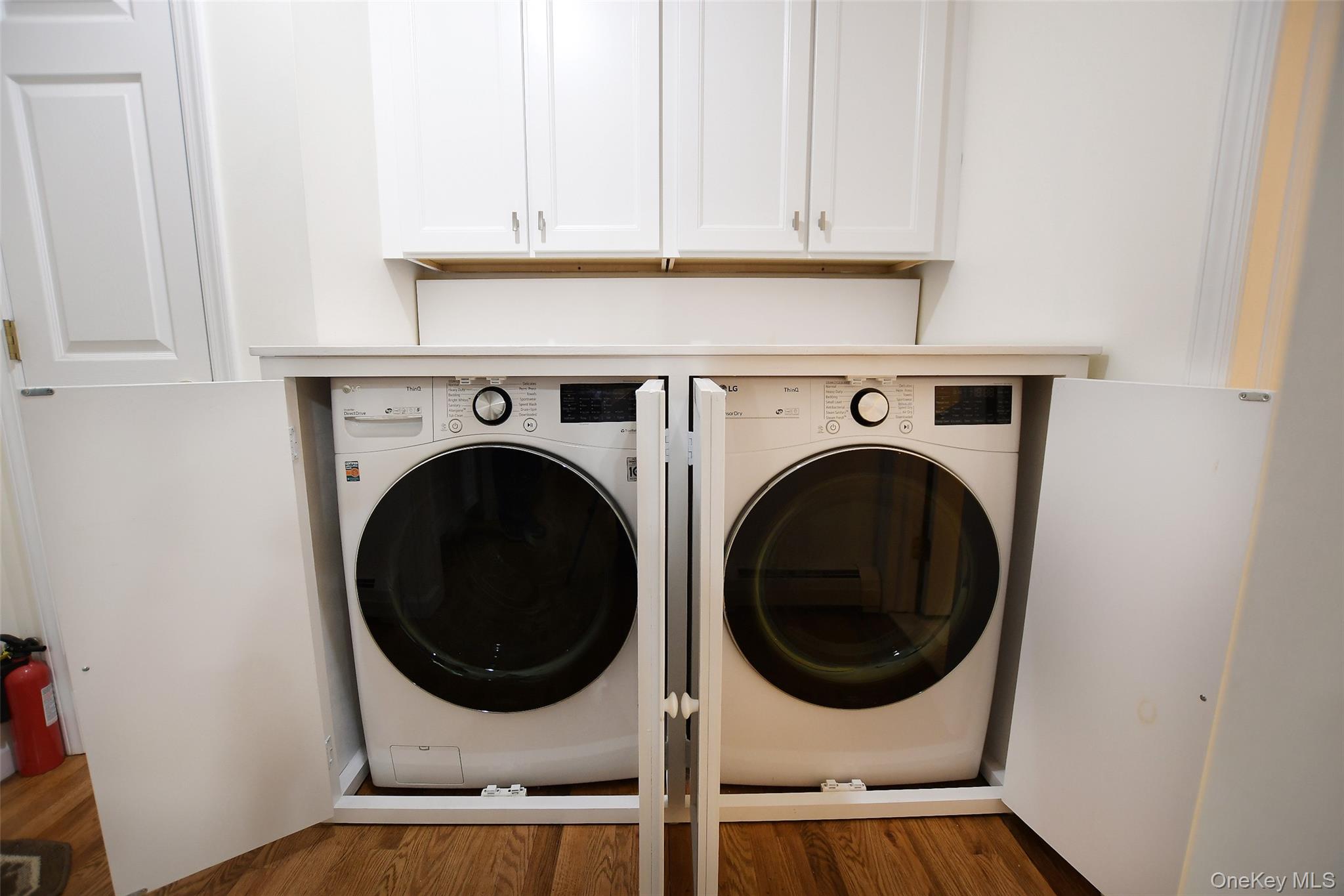 64 Glen Road Baiting Hollow, NY 11933 - Photo 25 of 46 Washroom featuring wood finished floors and washer and dryer