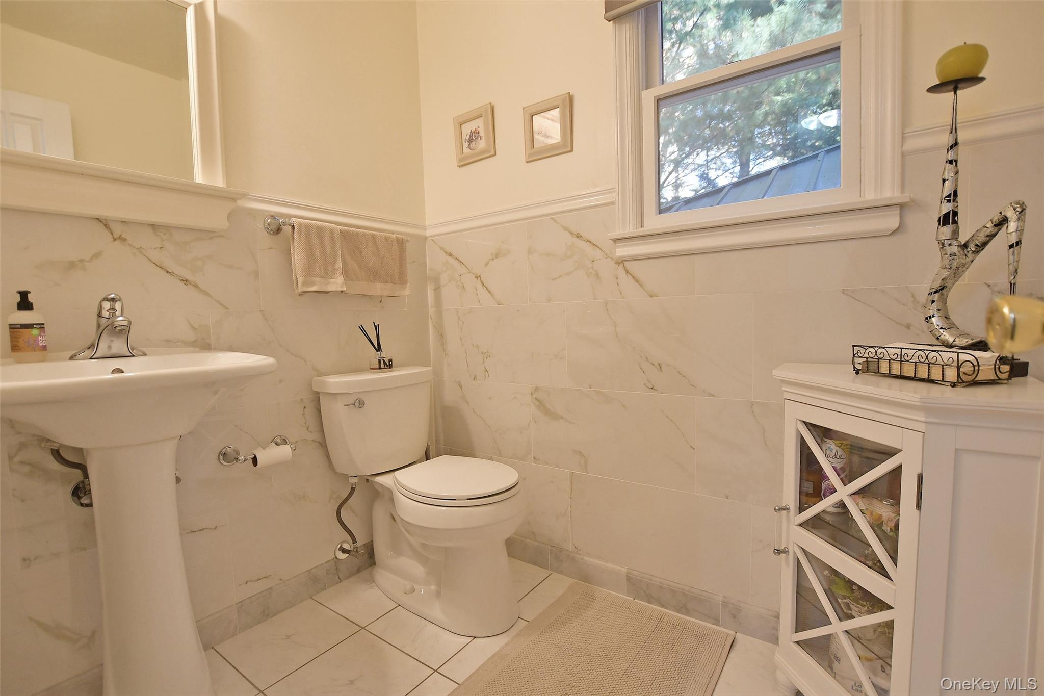 64 Glen Road Baiting Hollow, NY 11933 - Photo 27 of 46 Half bathroom with tile patterned floors and tile walls