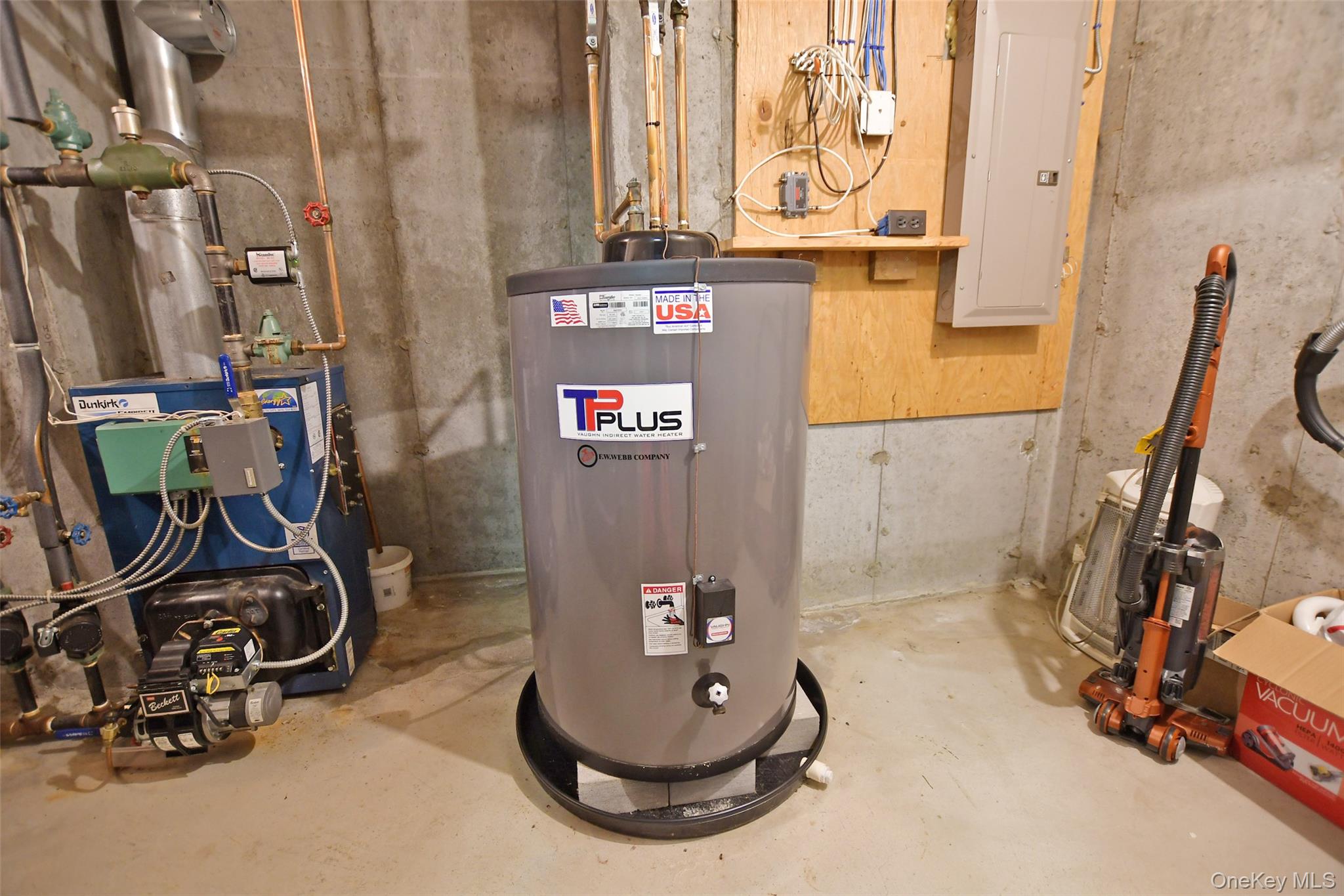 64 Glen Road Baiting Hollow, NY 11933 - Photo 32 of 46 Utility room with water heater, electric panel, and a heating unit