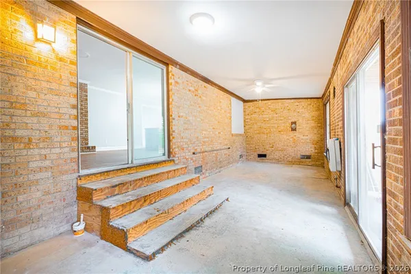 a view of a bedroom with a large window