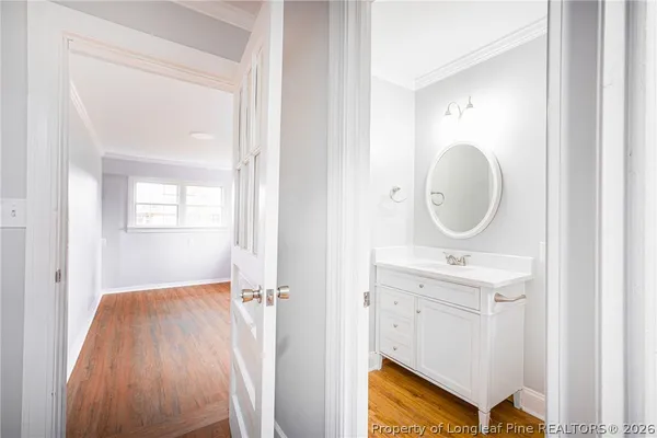 a bathroom with a sink a mirror and a toilet