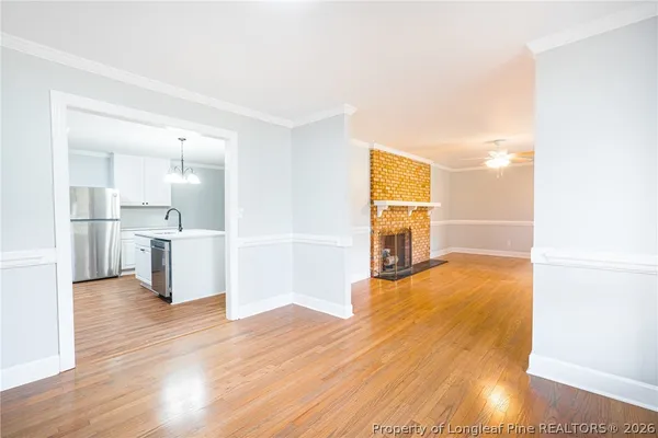 a view of a kitchen cabinets and wooden floor