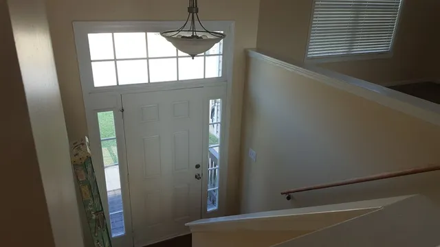 a view of a hallway with a window