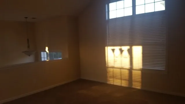 a view of an empty room and window