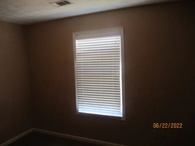 a view of a room that has a window in it