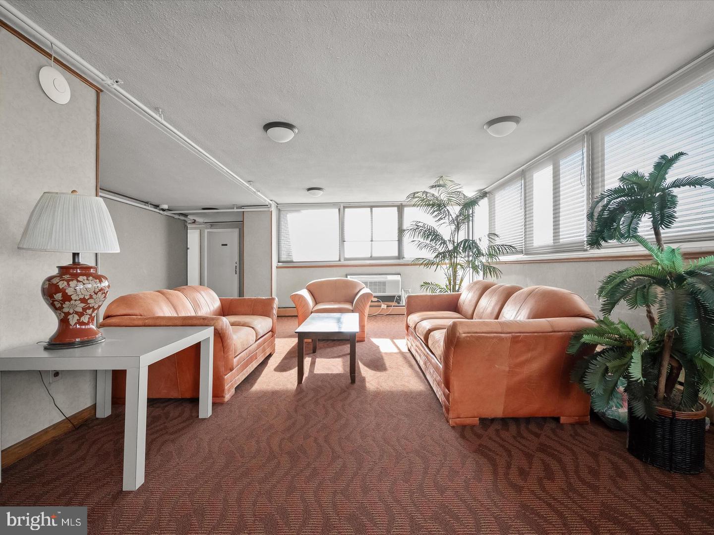 9701 Fields Road, Unit 1607 Gaithersburg, MD 20878 - Photo 21 of 26 a living room with furniture and a large window