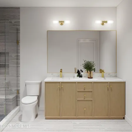 a bathroom with a sink a toilet and mirror