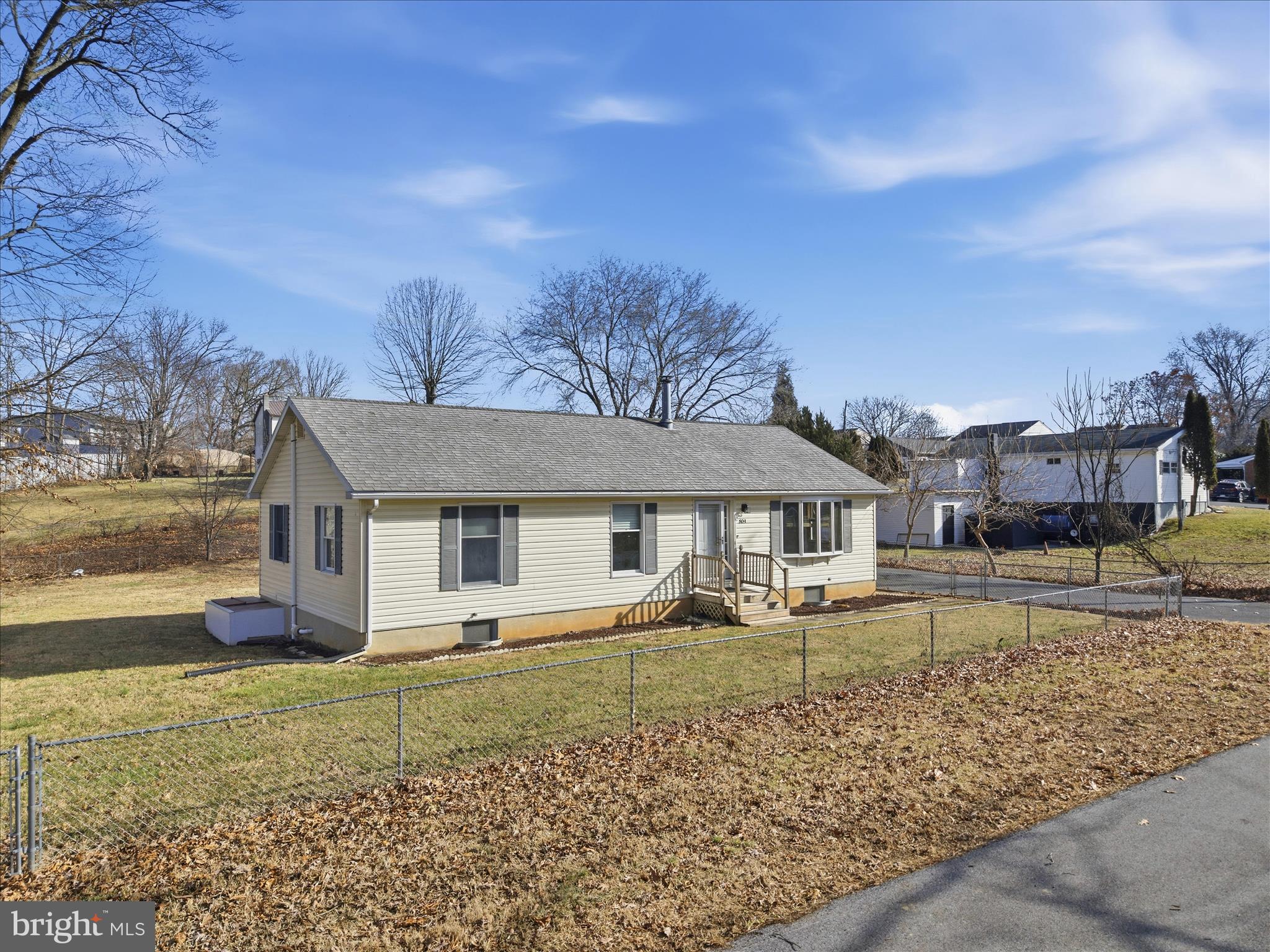 front view of a house with a yard