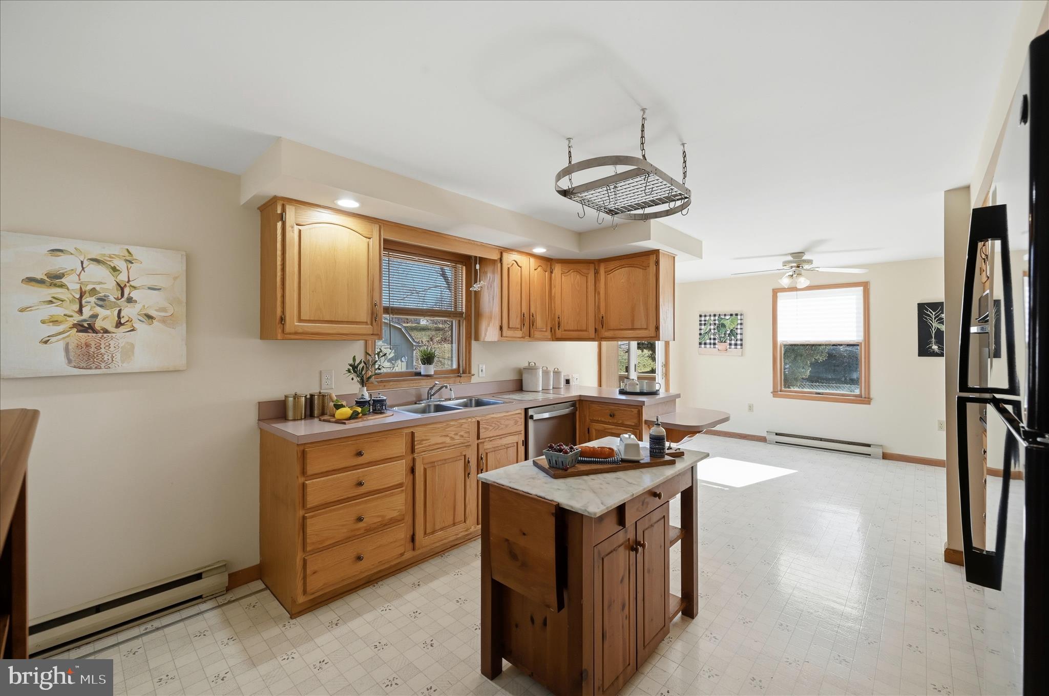 804 North Reymann Street Ranson, WV 25438 - Photo 20 of 53 a kitchen with stainless steel appliances granite countertop a stove a sink a refrigerator and a refrigerator