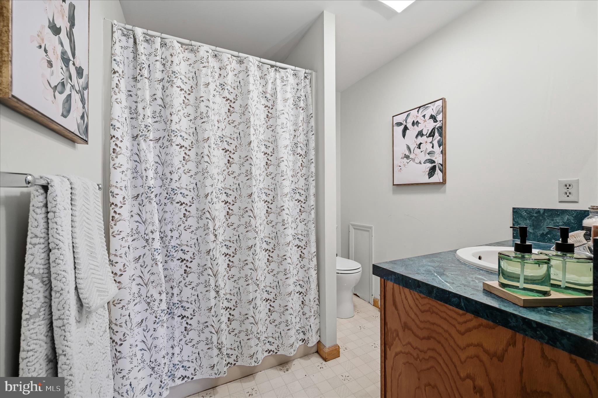 804 North Reymann Street Ranson, WV 25438 - Photo 25 of 53 a bathroom with a sink and a mirror