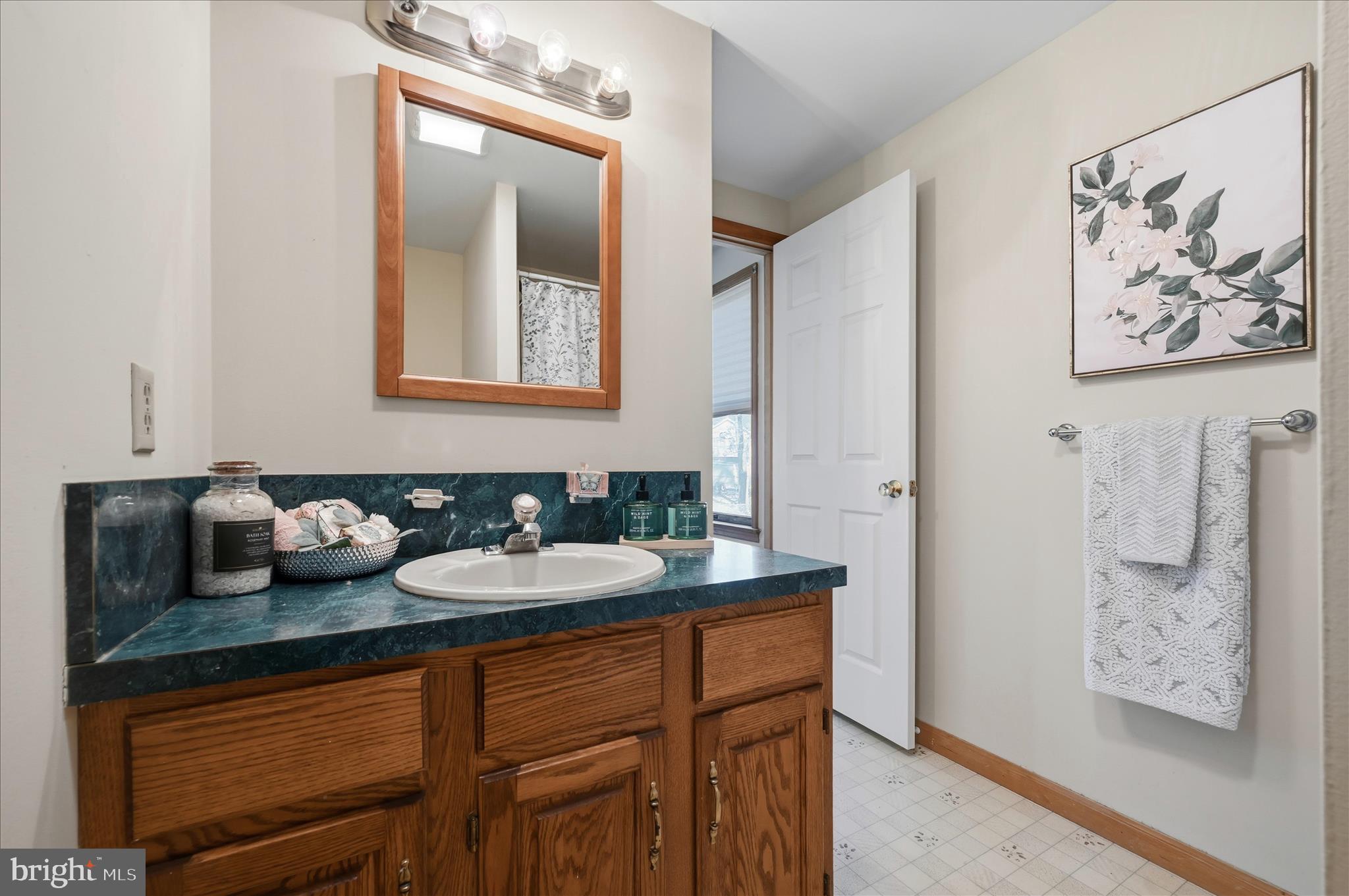 804 North Reymann Street Ranson, WV 25438 - Photo 27 of 53 a bathroom with a granite countertop sink and a mirror