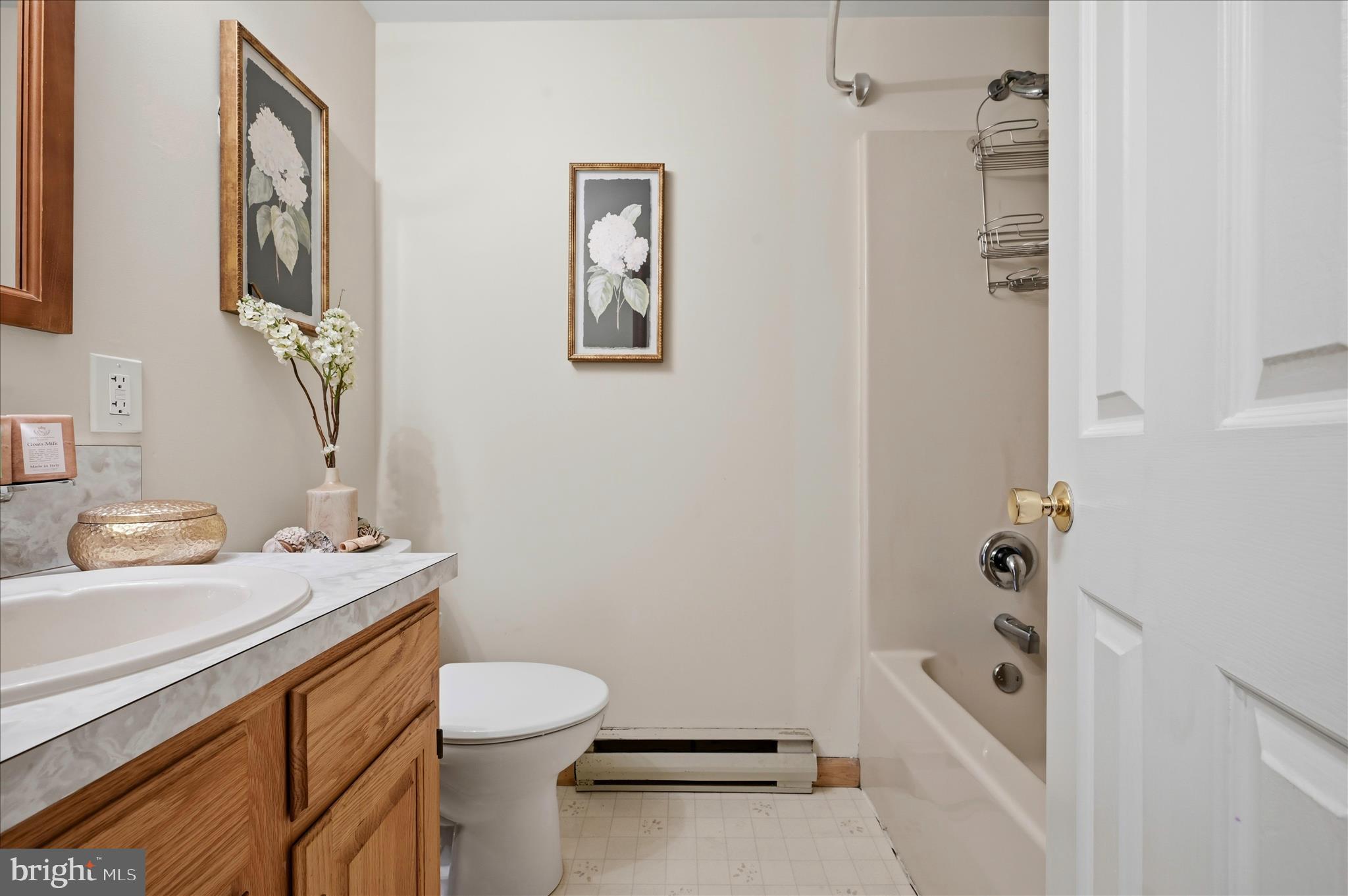 804 North Reymann Street Ranson, WV 25438 - Photo 30 of 53 a bathroom with a sink a toilet and a mirror