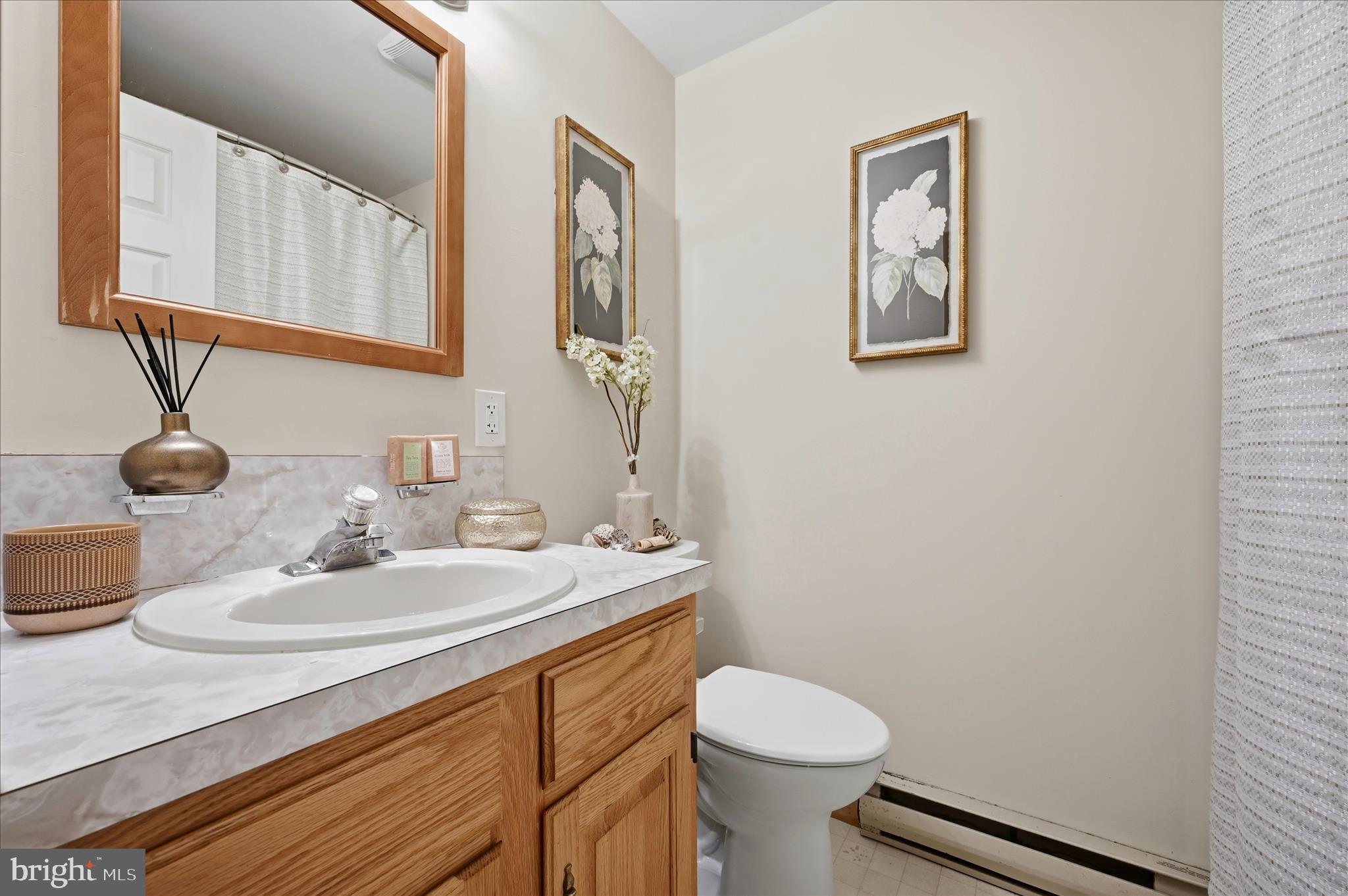 804 North Reymann Street Ranson, WV 25438 - Photo 31 of 53 a bathroom with a sink and a mirror