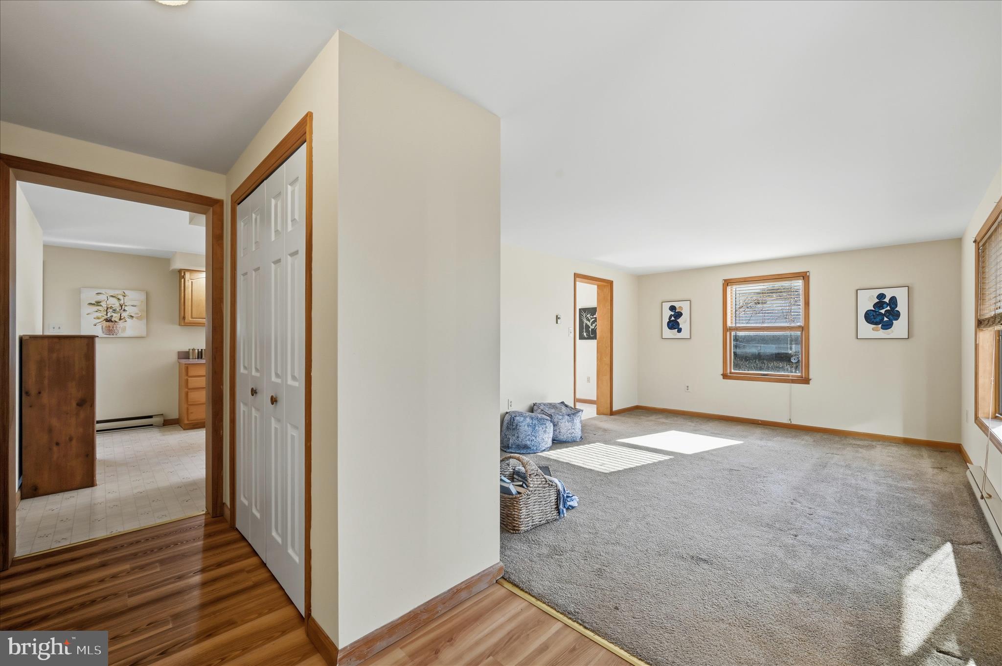 804 North Reymann Street Ranson, WV 25438 - Photo 5 of 53 a view of a hallway with wooden floor and bathroom