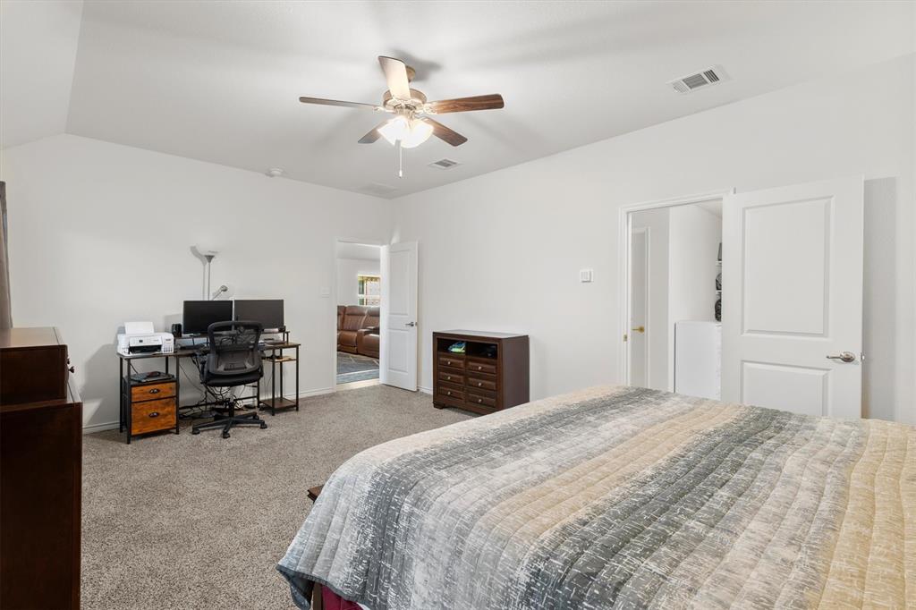 1302 Colonial Bluff Lane Princeton, TX 75407 - Photo 12 of 35 a bedroom with a bed and furniture