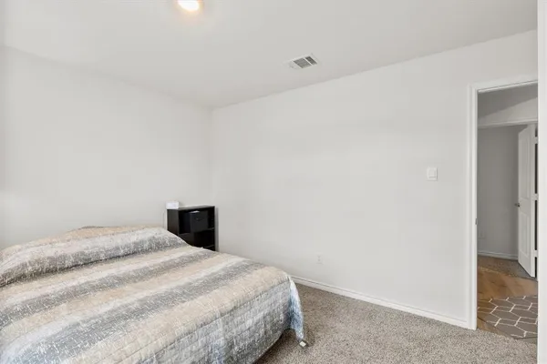 a en suite bathroom with a double vanity sink and a large mirror