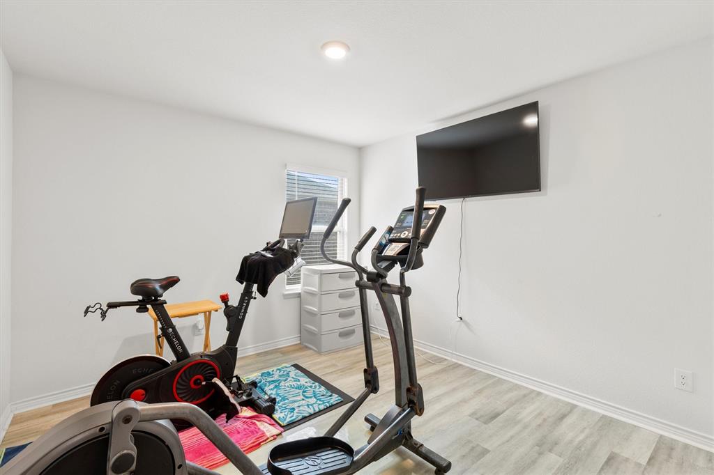 1302 Colonial Bluff Lane Princeton, TX 75407 - Photo 18 of 35 a view of a room with gym equipment