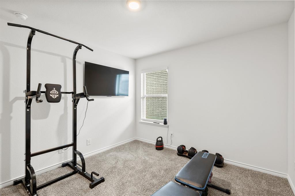 1302 Colonial Bluff Lane Princeton, TX 75407 - Photo 21 of 35 a view of a room with gym equipment