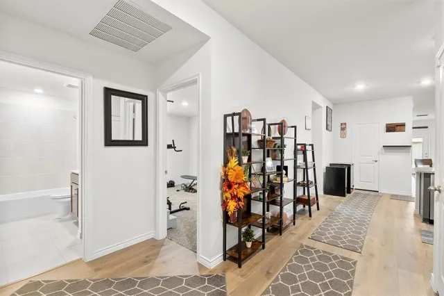 a room with gym equipment and a window