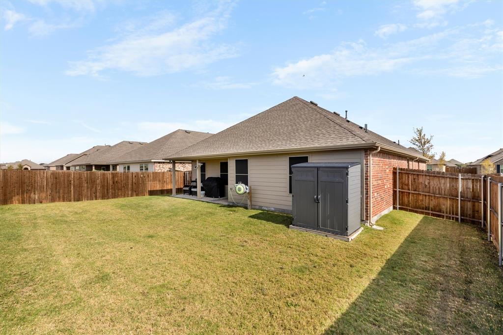 1302 Colonial Bluff Lane Princeton, TX 75407 - Photo 23 of 35 a view of a house with a yard and wooden fence