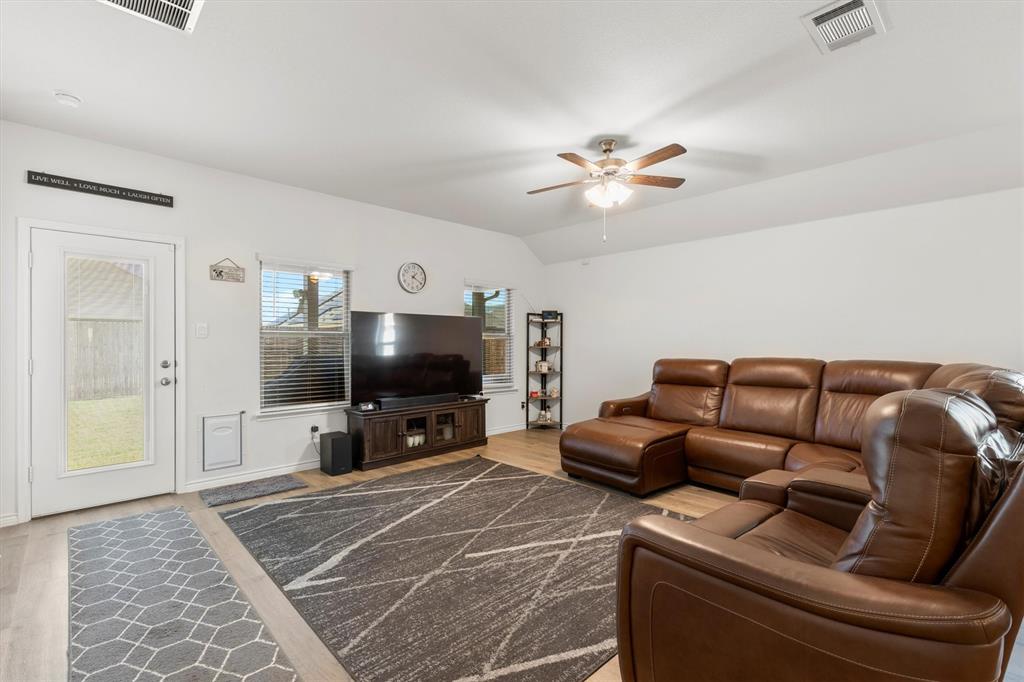 1302 Colonial Bluff Lane Princeton, TX 75407 - Photo 3 of 35 a living room with furniture and a flat screen tv