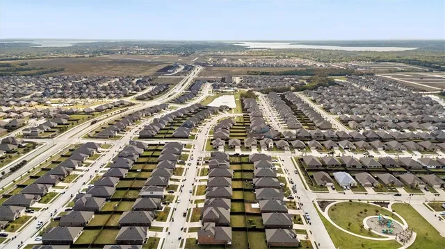 a view of a swimming pool with outdoor seating