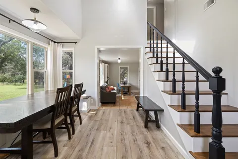 a view of a livingroom with furniture and hardwood floor