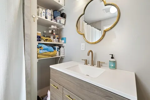 a bathroom with a sink and a mirror