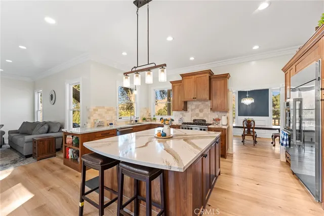 a view of a hallway with furniture and wooden floor