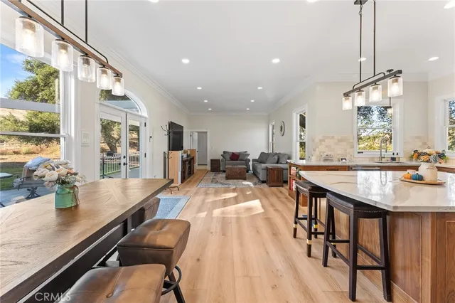 a bathroom with a granite countertop sink a mirror and a bathtub